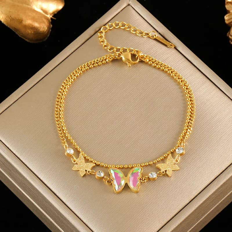 Pulsera con dijes de estrella de mar y concha sobre cadena de cordón