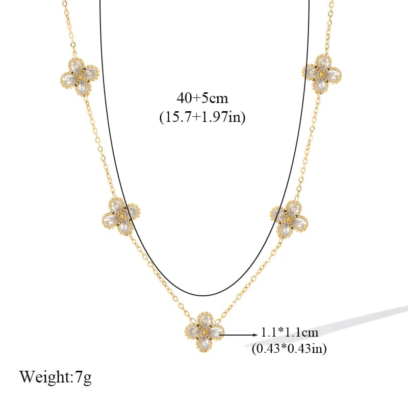 Conjunto de collar, pendientes y pulsera floral con circonitas