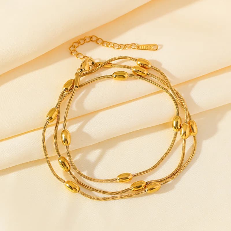 Set de collar y pulsera de cadena apilable multicapa en color dorado