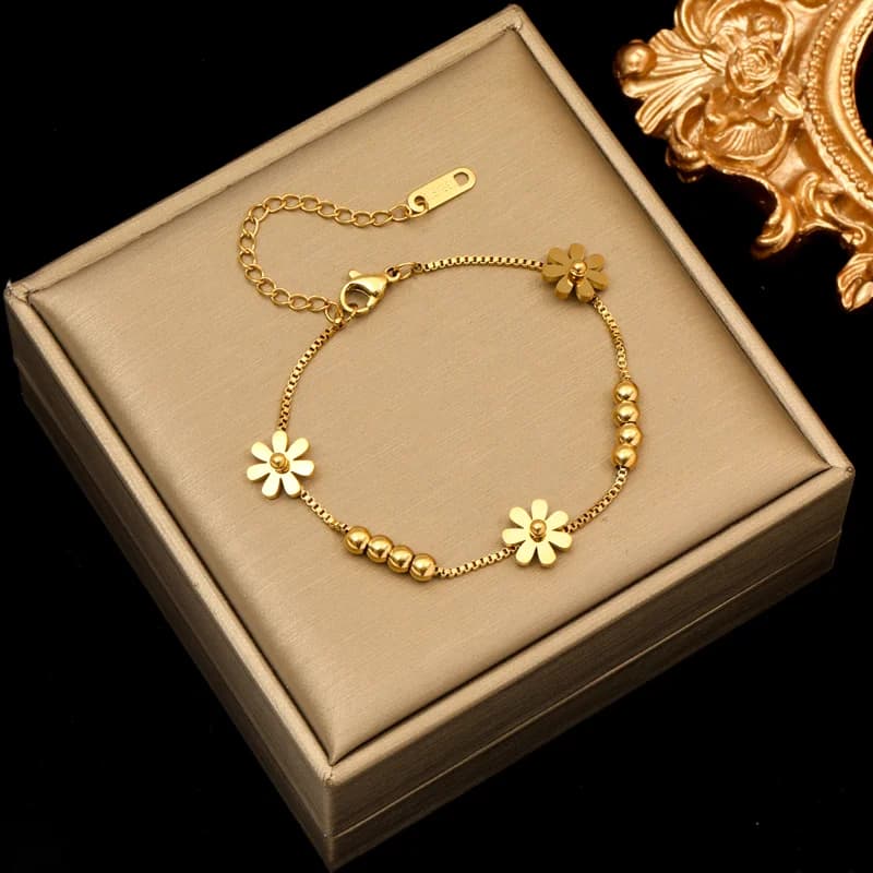 Set de collar y pulsera con flor en color dorado