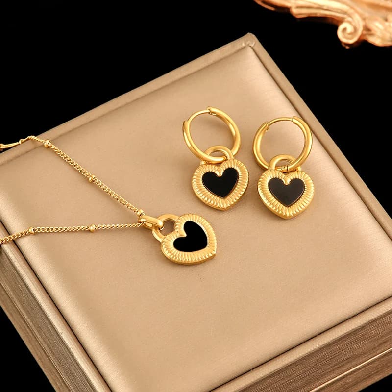 Set de collar y pendientes con motivos de estrella, flor y oso